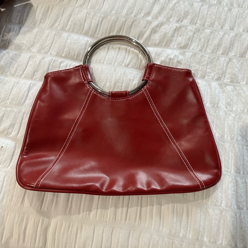 Red purse with silver ring handles